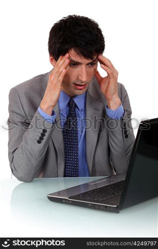 A businessman having a headache.
