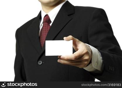 A businessman holding a business card