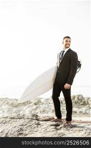 A Businessman holding is surfboard after a long day of work