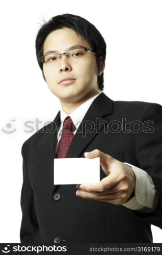 A businessman holding up a blank business card