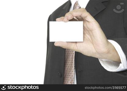 a businessman holds up a blank business card