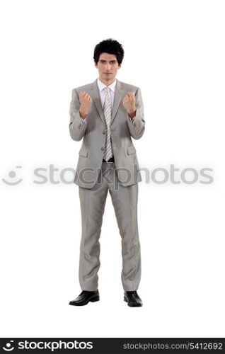 A businessman in a fighting stance.