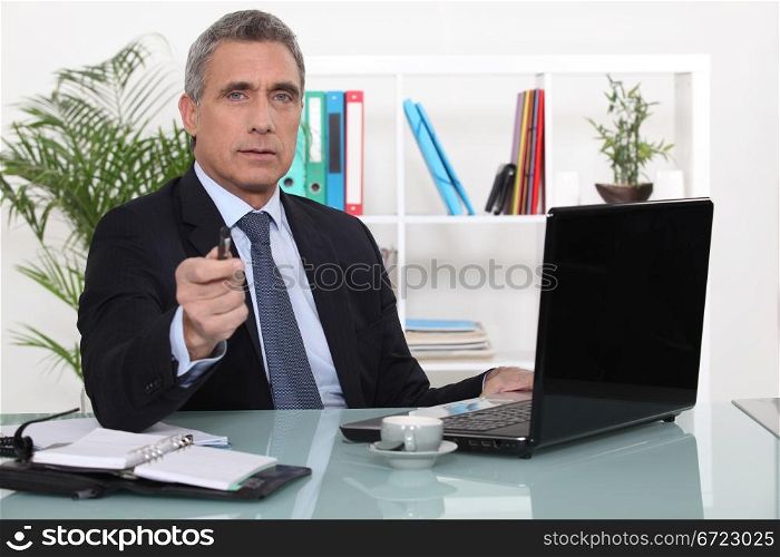 A businessman in his office