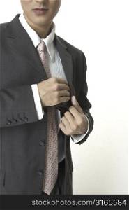 A businessman pulls his wallet from his jacket pocket