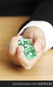 A businessman rolling a dice