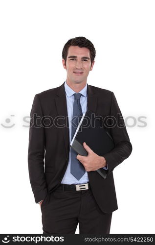 A businessman standing with his folder.