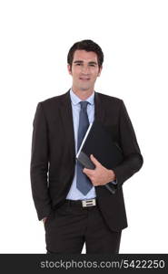 A businessman standing with his folder.