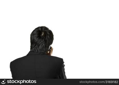 A businessman talking on the phone (isolated)