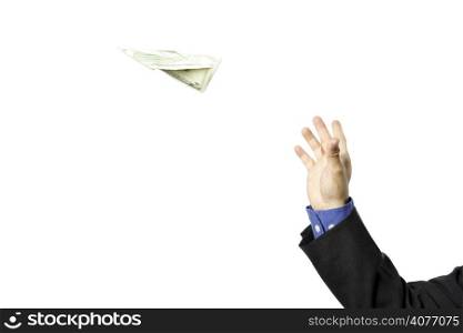 A businessman trying to fly a paper airplane made out of dollar bill, can be used for money concept