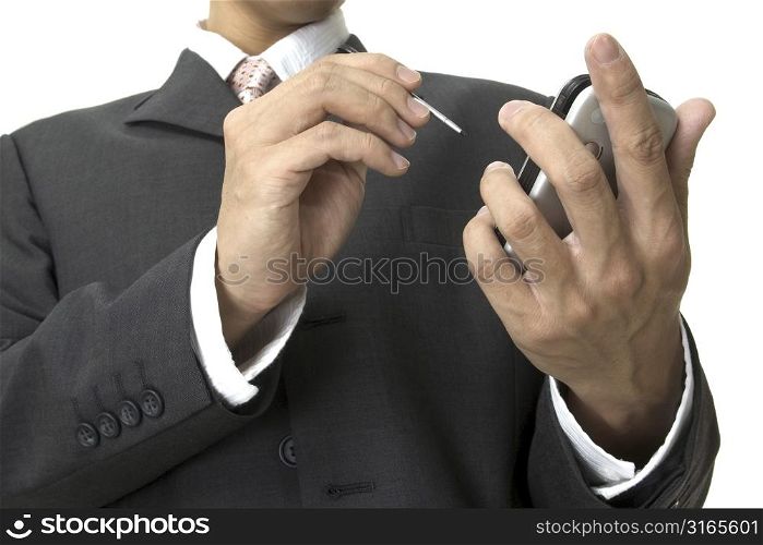 a businessman uses an electronic organiser