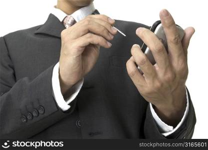 a businessman uses an electronic organiser