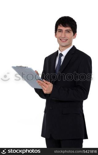 A businessman with a clipboard.