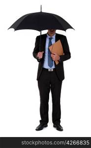 A businessman with an umbrella.