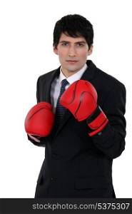 A businessman with boxing gloves.