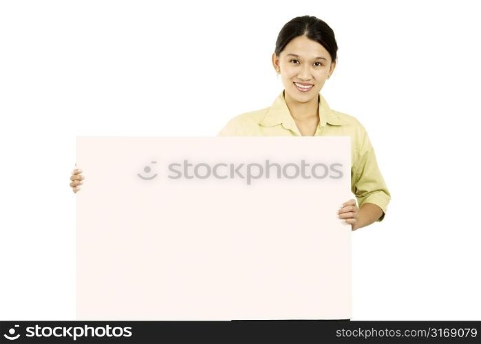 A businesswoman carrying a blank display card