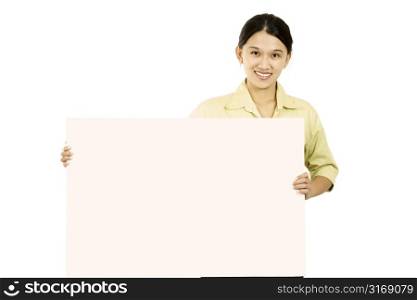 A businesswoman carrying a blank display card