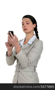 A businesswoman checking her Smartphone.
