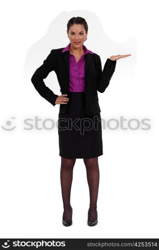 A businesswoman gesturing the tea pot.