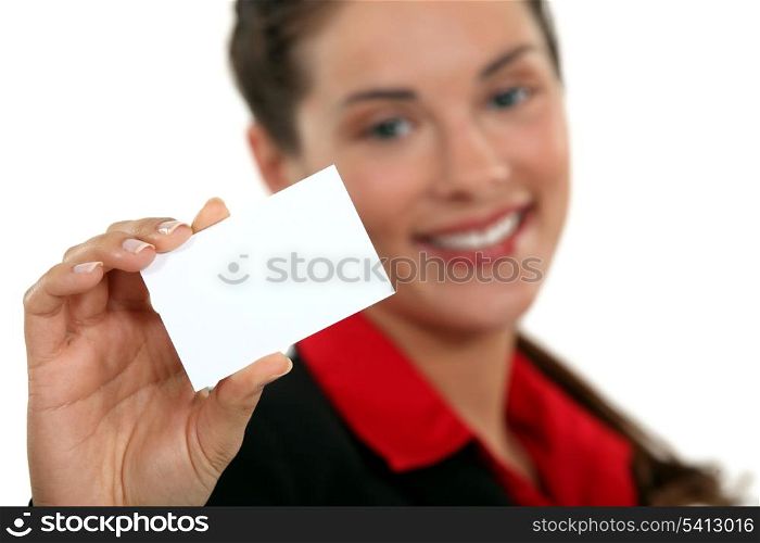 A businesswoman handing her card.