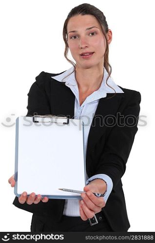 A businesswoman making a client sign a contract.