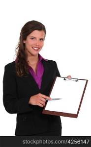 A businesswoman presenting a clipboard.