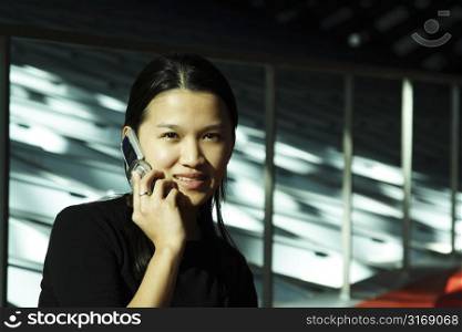 A businesswoman talking on a cell phone