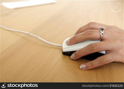 A businesswoman using a mouse