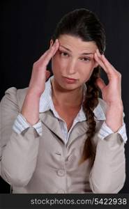 A businesswoman with a headache.