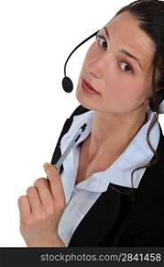 A businesswoman with a headset on.