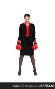 A businesswoman with boxing gloves on.