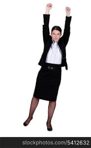 A businesswoman with her two fists up.