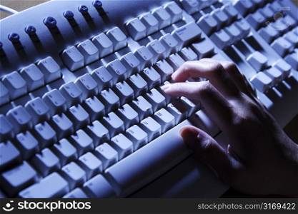 A businesswoman working and typing on her keyboard