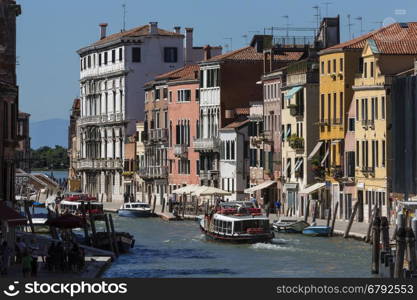 A busy waterway in Venice in northern Italy. Situated on a lagoon of the Adriatic, Built on numerous islands that are separated by canals and linked by bridges. Venice was a powerful republic in the Middle Ages and from the 13th to the 16th centuries a leading sea power, controlling trade to the eastern Mediterranean. The lagoon and much of the city are listed as a UNESCO World Heritage Site.