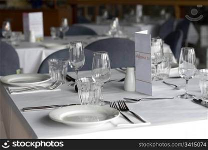 A cafe table prepared for diners