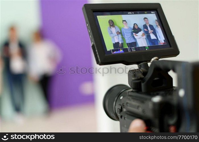 a cameraman with professional equipment shoots video clips in the studio 