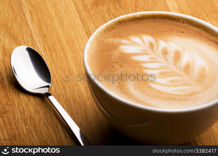 A cappuccino in a bowl with latte art