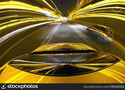 A car driving on a mortorway at high speeds