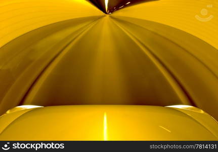 A car driving through a single lane tunnel