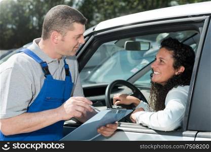 a car mechanic with customer