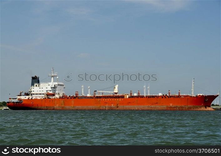 A cargo ship moored at a dock