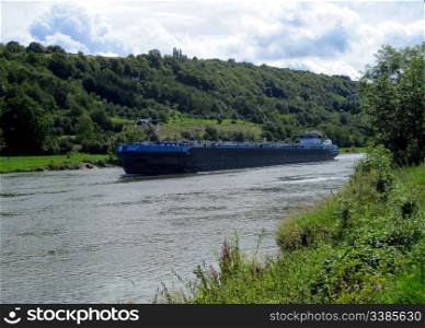 A Cargo Vessel on the Moselle River in Luxembourg