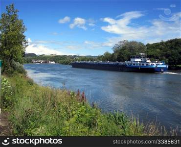 A Cargo Vessel on the Moselle River in Luxembourg