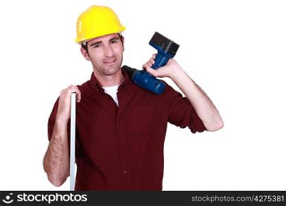 A carpenter holding a drill.