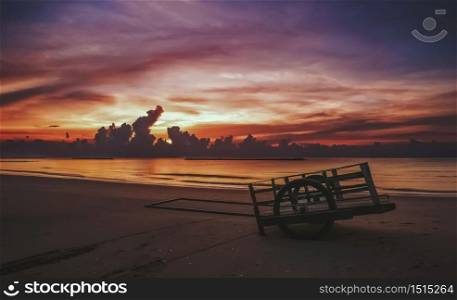 a cart on sand and beach sunrise