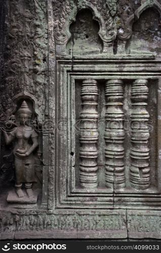 A carved wall of the Angkor temples in Siem Reap, Cambodia.