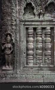 A carved wall of the Angkor temples in Siem Reap, Cambodia.