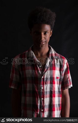 A casual young black boy posing isolated