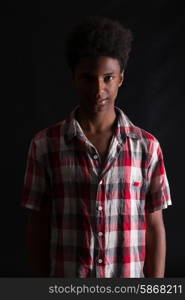 A casual young black boy posing isolated