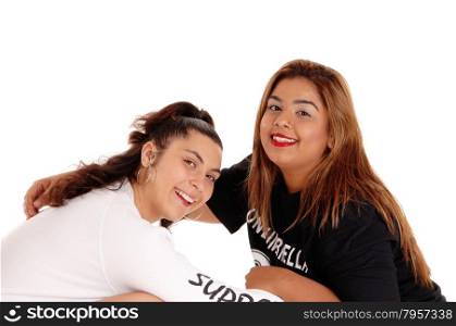 A Caucasian and East Indian women in a closeup picture having fun witheach other, isolated for white background.