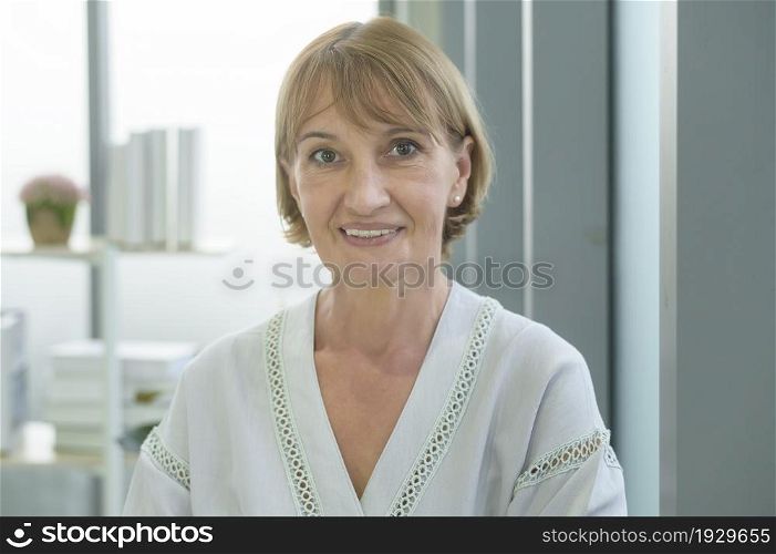 A caucasian senior Businesswoman confident in modern office. Caucasian senior Businesswoman confident in modern office